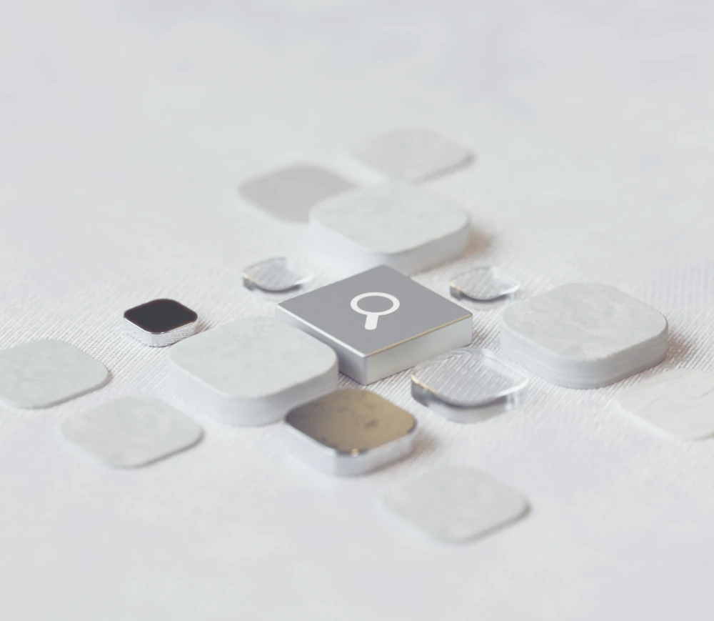 Macro search icon amongst abstract squares.